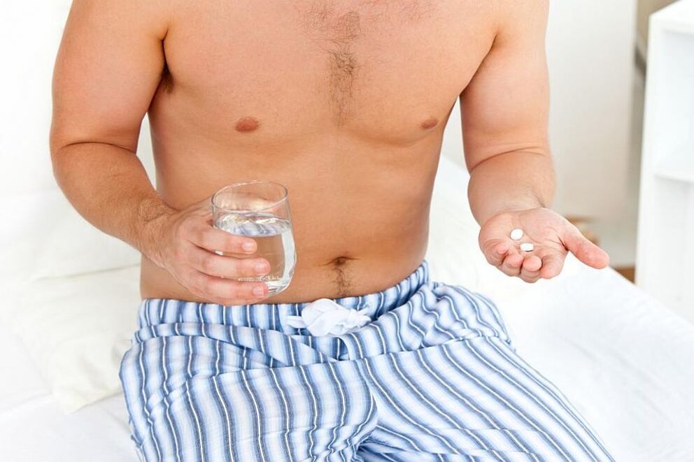 a person takes pills for prostatitis